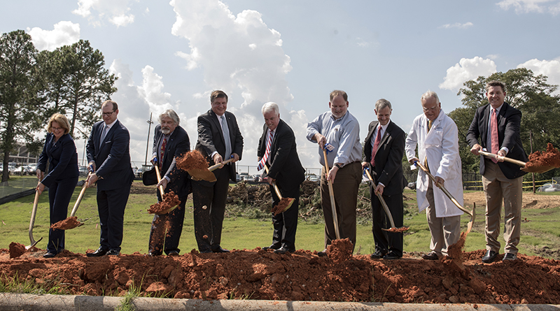The shovels made it official. The first throw of the dirt was taken by those who have worked to build the American Cancer Society Hope Lodge and representatives of hospitals whose patients will use it. From left are, Sheila Grogan, Blue Cross/Blue Shield of Mississippi; Kirk Sims, Yates Construction; Dr. Ralph Vance, professor emeritus, UMMC, and ACS Capital Campaign Committee member; Jerry Host, president and CEO of Trustmark Corporation and Capital Campaign Committee chair; Mike Neal, ACS executive vice president; John Lewis, Gertrude C. Ford Foundation director; Claude Harbarger, president of St. Dominic Health Services; Dr. John Ruckdeschel, UMMC Cancer Institute director; Whit Hughes, Baptist Health Services Foundation.